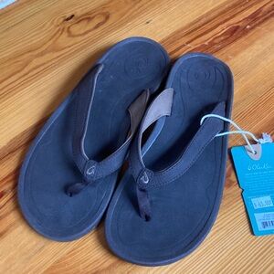 OluKai Dark Brown and Black Sandals